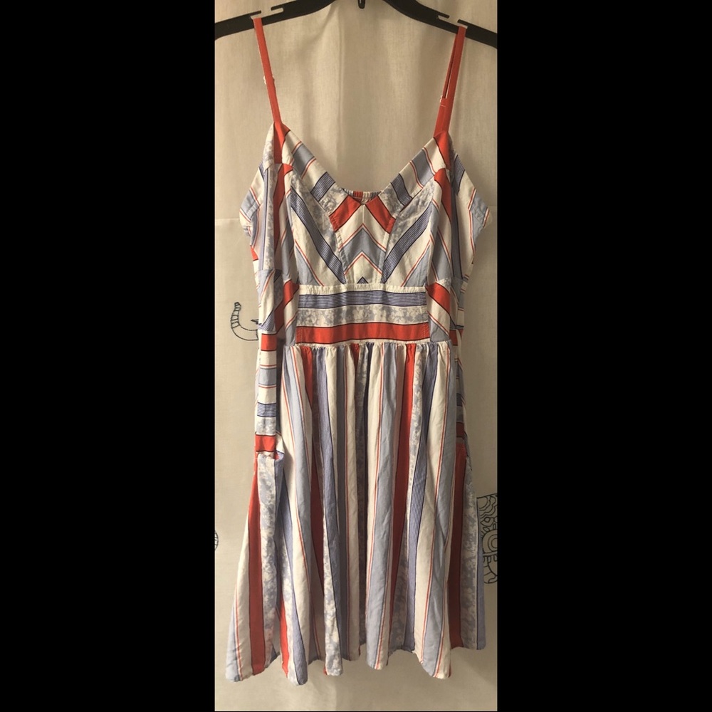 Blue and red dress with pockets.